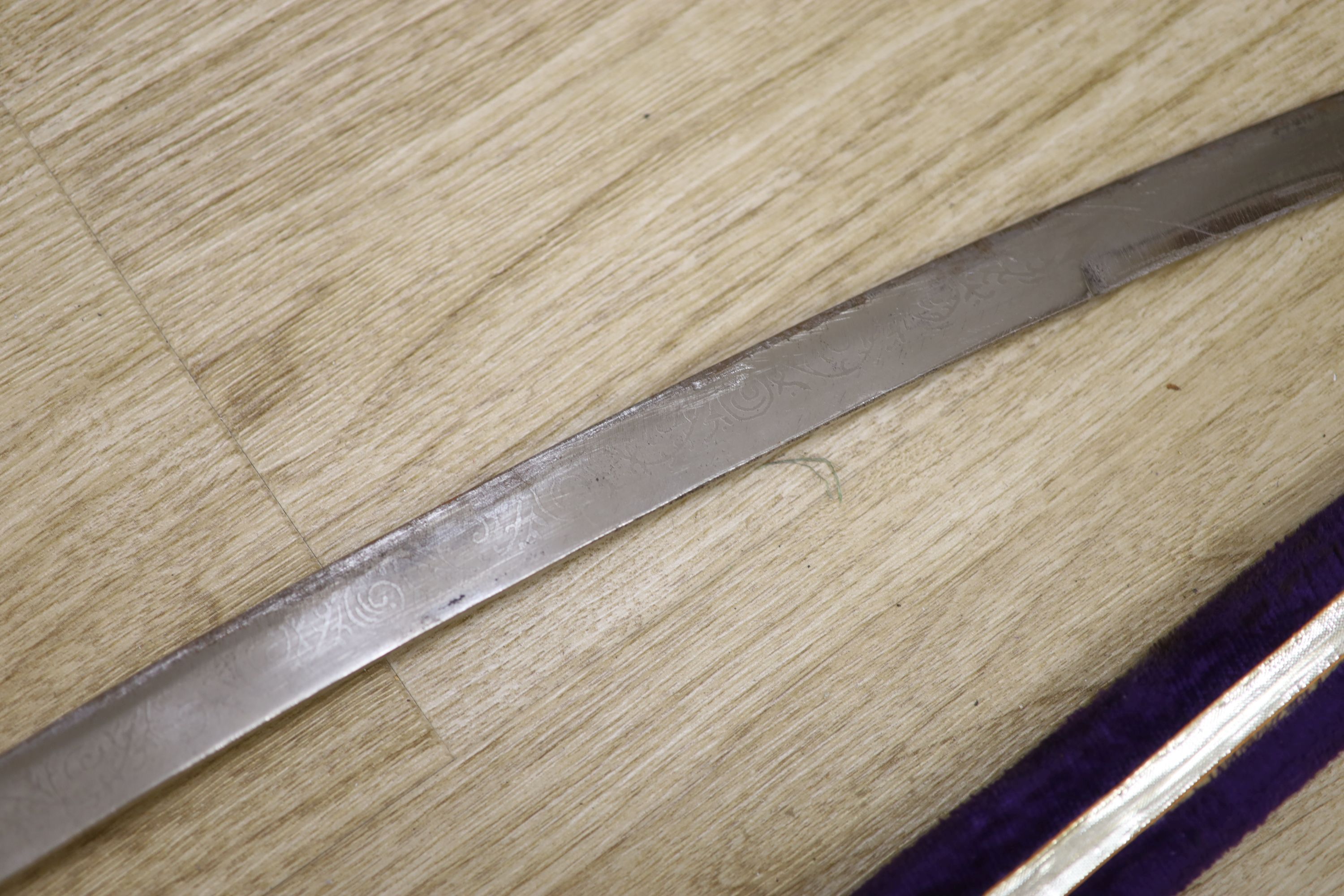 A 20th century Indian sabre with velvet scabbard, length 90cm